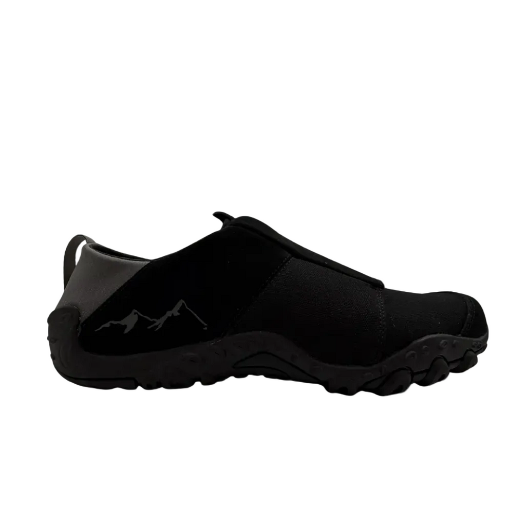 Black slip-on shoe on a white background