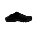 Black slip-on shoe on a white background
