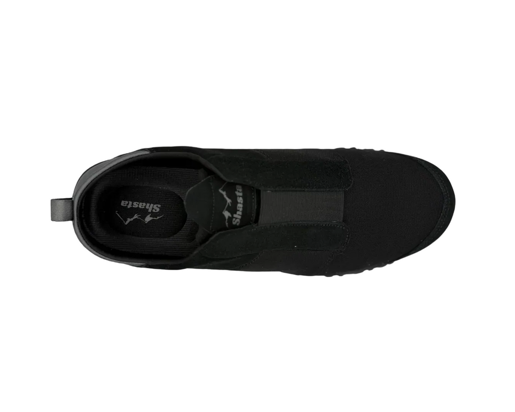 Black slip-on shoe on a white background